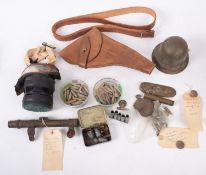 A collection of WWI field excavated militaria, including an 18pdr wheel hub, a telescopic sight,