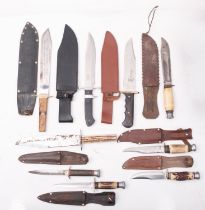 A group of nine various Bowie style knives, various makers and a WWII fighting knife,