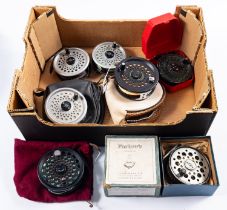 A boxed Farlow's Serpent 3 1/2 inch fly reel, together with a group of six other fly reels,