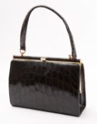 A mid-twentieth century black Crocodile handbag, unsigned.
