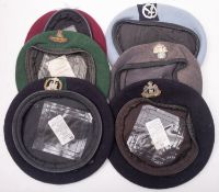 A group of six various berets, including Suffolk Regiment,