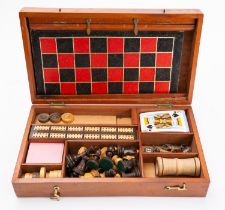 A mahogany cased game compendium, comprising boxwood Staunton pattern chess set, cards, draughts,