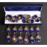 A collection of twenty- two Excelsior Football League silver and enamel prize medallions dating