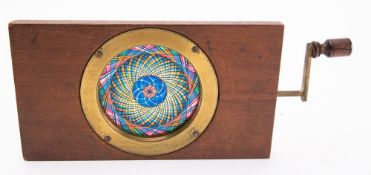 A 19th century Chromotrope, unsigned, with blue, yellow, pink and black kaleidoscope effect.