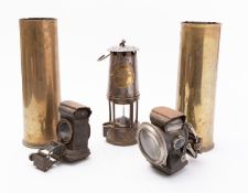Two World War I shell cases 18 PR II, CF 1915, two bicycle lamps,
