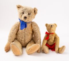 An early 20th century blonde plush Teddy bear with glass eyes,