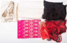 Two late 19th/early 20th century silk tassel fringe shawls, one in red the other in black,