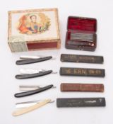 A late 19th/ early 20th century leather case set of seven single edge razors and tortoiseshell