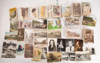 A collection of early 20th century and later postcards, various printers and subject matter,