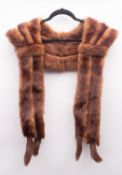 A collection of various fur stoles, together with a small muff,