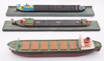 A group of scratch built model barges and sailing boats.