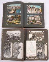 Two early 20th century postcard albums and contents, mainly GB and Foreign topographical cards,