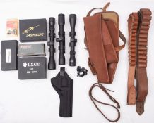 A collection of shooting accessories, comprising cartridge belts, scopes, gun slip etc.