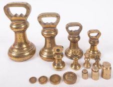 A set of seven brass bell weights graduated from 7lb,
