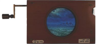 'Ship sailing towards rocks' [ship moves across, waves undulate] Maker unknown (7 x 4 1/2 x 3/4