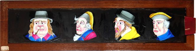'Four comic faces' [eyes move side to side] Maker unknown (15 x 4 x 3/8 inches), single slip