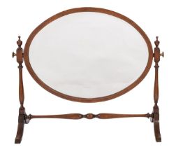 A mahogany and crossbanded oval dressing