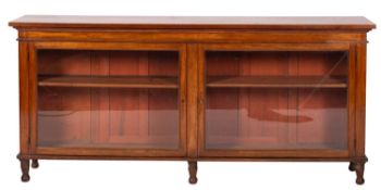A mahogany and glazed dwarf bookcase, ea