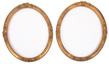 A pair of oval gilt composition picture