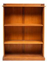 A contemporary oak open bookcase; with a