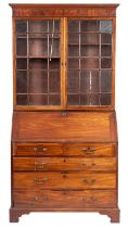 A George III mahogany bureau and an asso