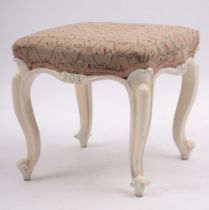 A carved and painted wood dressing table