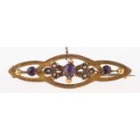 An amethyst and seed pearl brooch, the openwork panel set with circular cut amethysts and seed