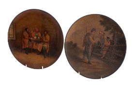 A pair of Vishnyakov [Russian] black lacquer plates painted with pastoral scenes, 23cm diameter,