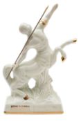 A bottle of Remy Martin Fine Champagne Cognac in a 'Centaure Limoges' ivory porcelain decanter, in