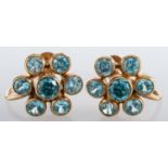 A pair of 9ct gold blue zircon cluster earrings; each flowerhead cluster collet set with brilliant