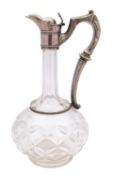 A late 19th century silver plated and cut glass claret jug, of classical form, with globular body,