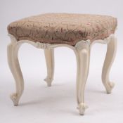 A carved and painted wood dressing table stool, in Louis XV taste, late 19th century; with