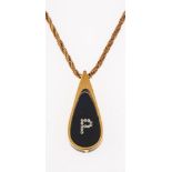 A pendant and chain; 9ct gold rope chain with unmarked yellow metal pendant, the interior with resin