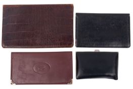 Cartier, Paris. A brown leather wallet, together with two other unsigned wallets and a black leather