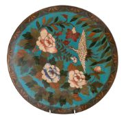 A Japanese cloisonné plate decorated with a crane amongst peony, 30cm diameter, late Meiji,
