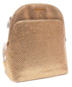 Michael Kors. An Adele gold leather backpack, with original tags and packing tissue to handles.