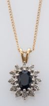 A diamond and sapphire cluster pendant set in white and yellow gold,on fine gold chain, 9ct,