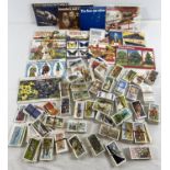 A collection of assorted vintage Brooke Bond tea cards together with 14 assorted collectors albums.