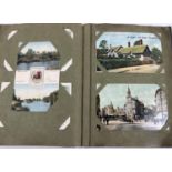 A small Victorian postcard album containing approx. 95 assorted postcards.