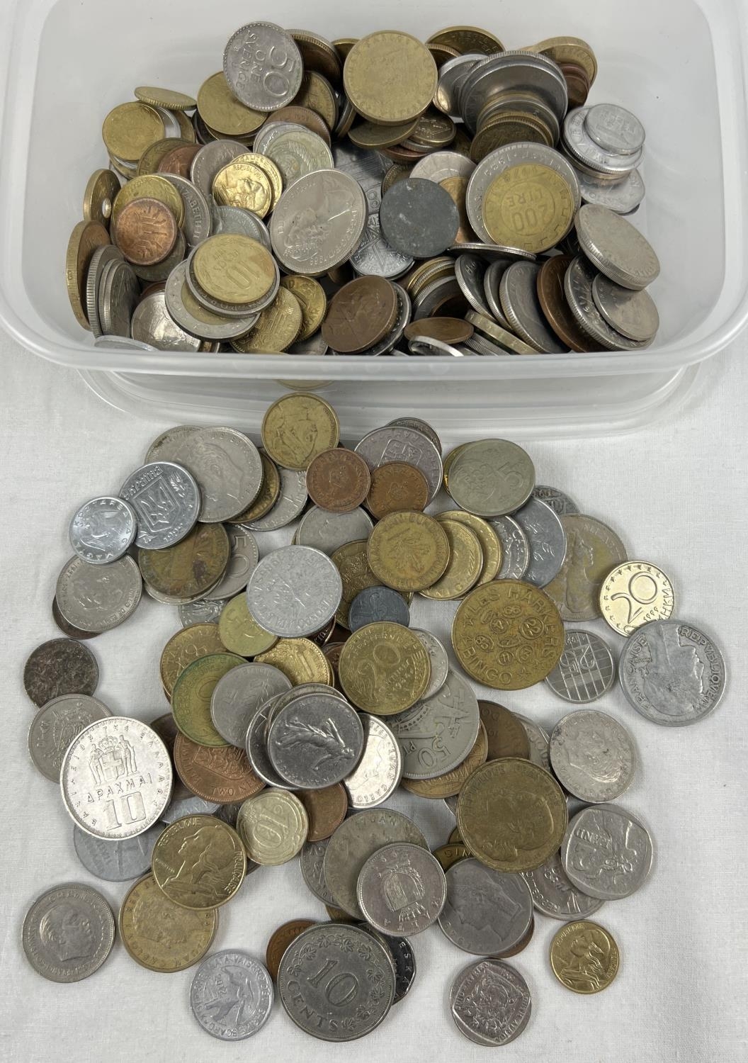 A small tub of vintage British and foreign coins. To include examples from Portugal, Costa Rica,