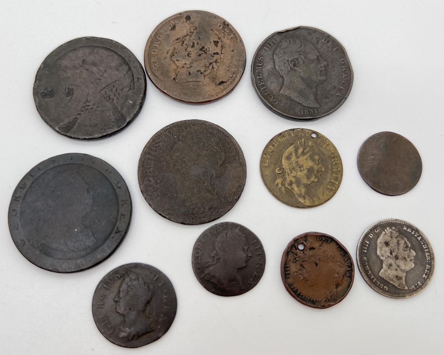 A collection of Georgian coins, in varying conditions. To include George IV 1834 silver shilling,