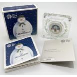 A 2019 limited edition "The Snowman" colourised silver proof 50p coin by The Royal Mint. Held within
