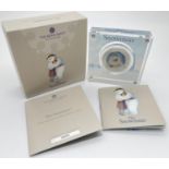 A 2020 limited edition colourised "The Snowman" silver proof 50p coin by The Royal Mint. In a