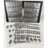 A black folder containing collectors display sleeves of vintage British pennies, half pennies,