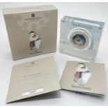 A boxed limited edition 2020 silver proof "The Snowman" colourised 50p coin encased in a clear
