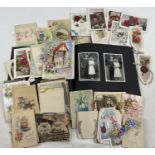 A box of approx. 60 assorted Victorian & vintage greetings cards, together with a vintage album of