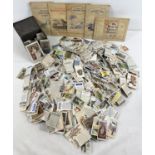 A box containing a large quantity of assorted vintage cigarette cards together with 5 albums (4