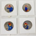 A set of 4 Paddington Bear 50p coins with coloured decals. Comprising: 2018 Paddington at the