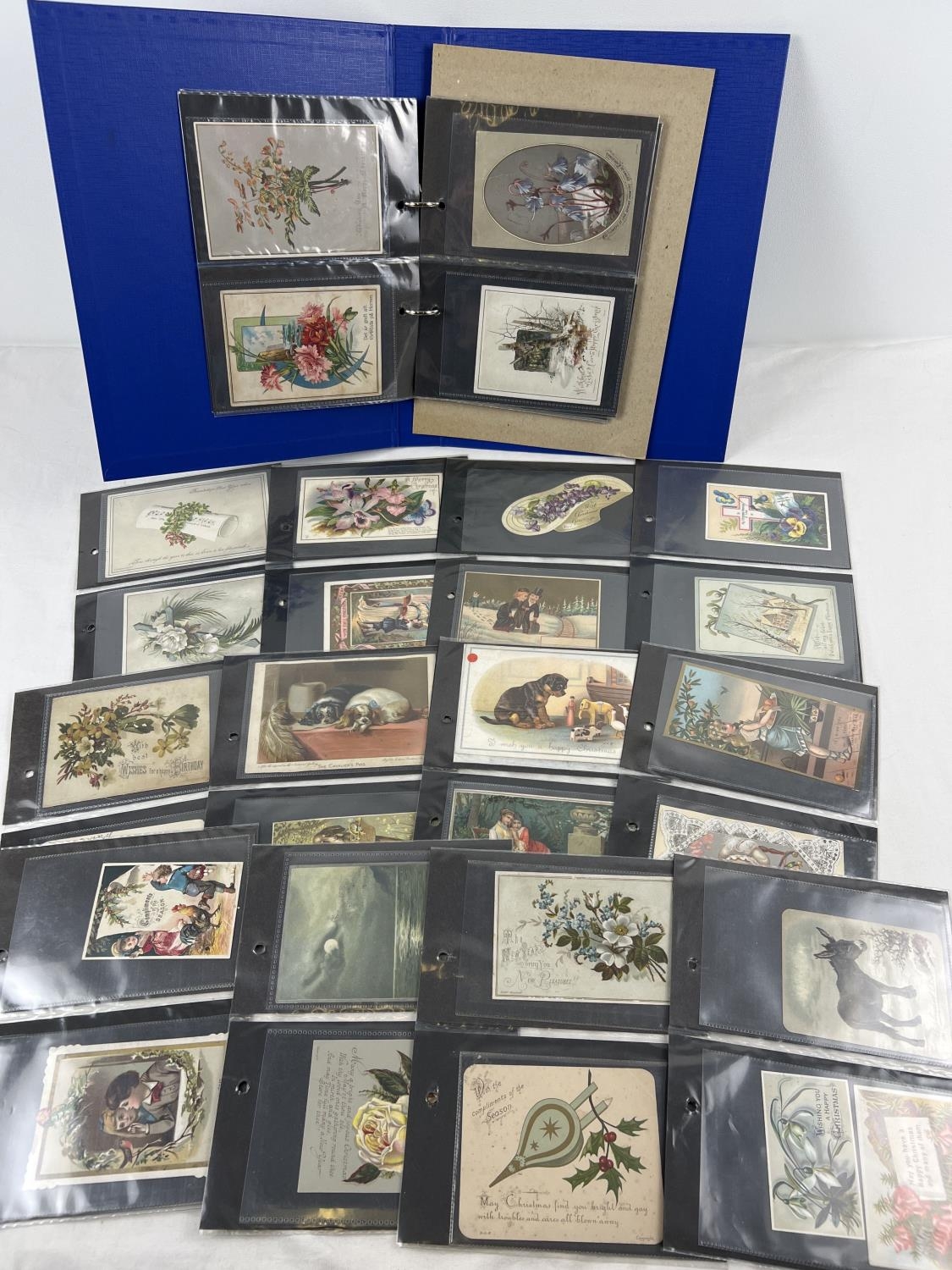 An album containing 83 assorted Victorian & Edwardian greetings cards. In carded plastic wallets.