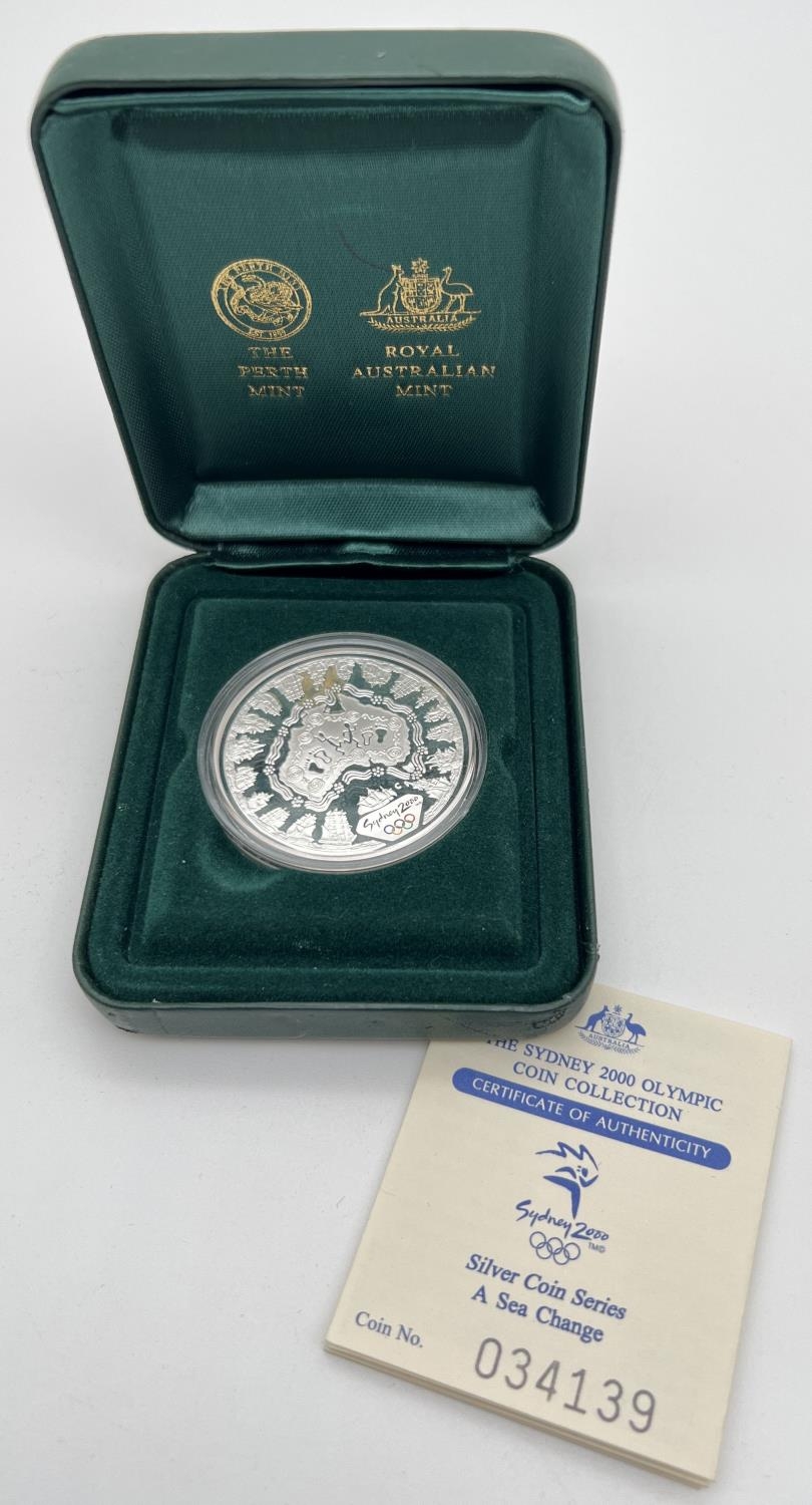 A collectors silver proof 5 dollar coin produced for the 2000 Sydney Olympics. Complete with clear